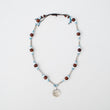 Collana metal con perline in legno marrone e azzurro con nappina bianca con madreperla COD: 21132502800
